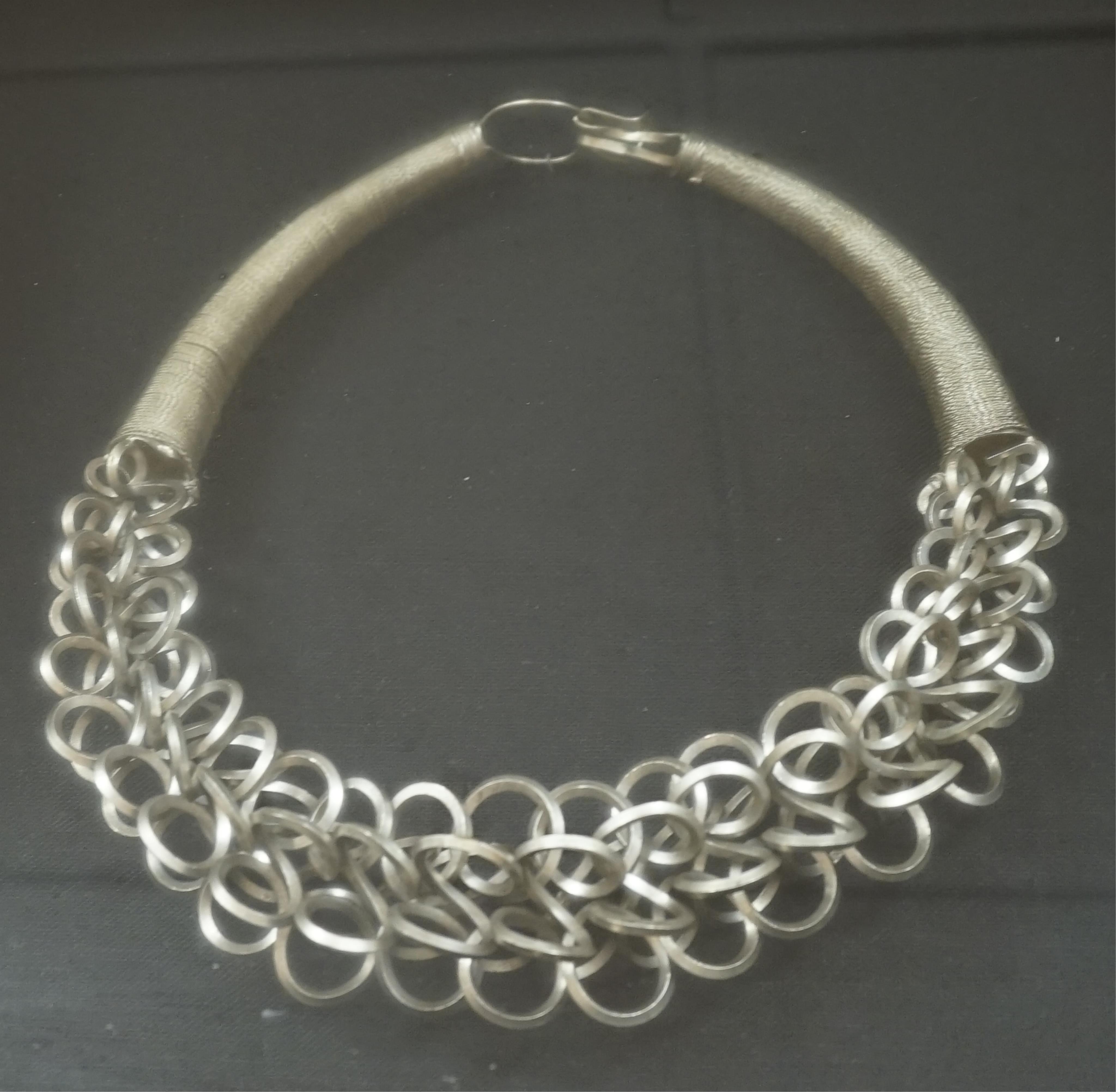 Two Chinese Miao framed white metal necklaces, frames 55cm sq. condition - fair to good